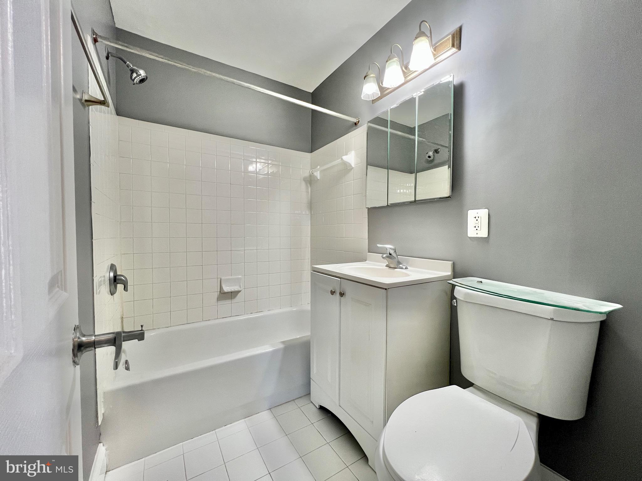 1009 Chillum Road, Unit 202 Hyattsville, MD 20782 - Photo 11 of 19 a bathroom with a toilet a sink and bathtub