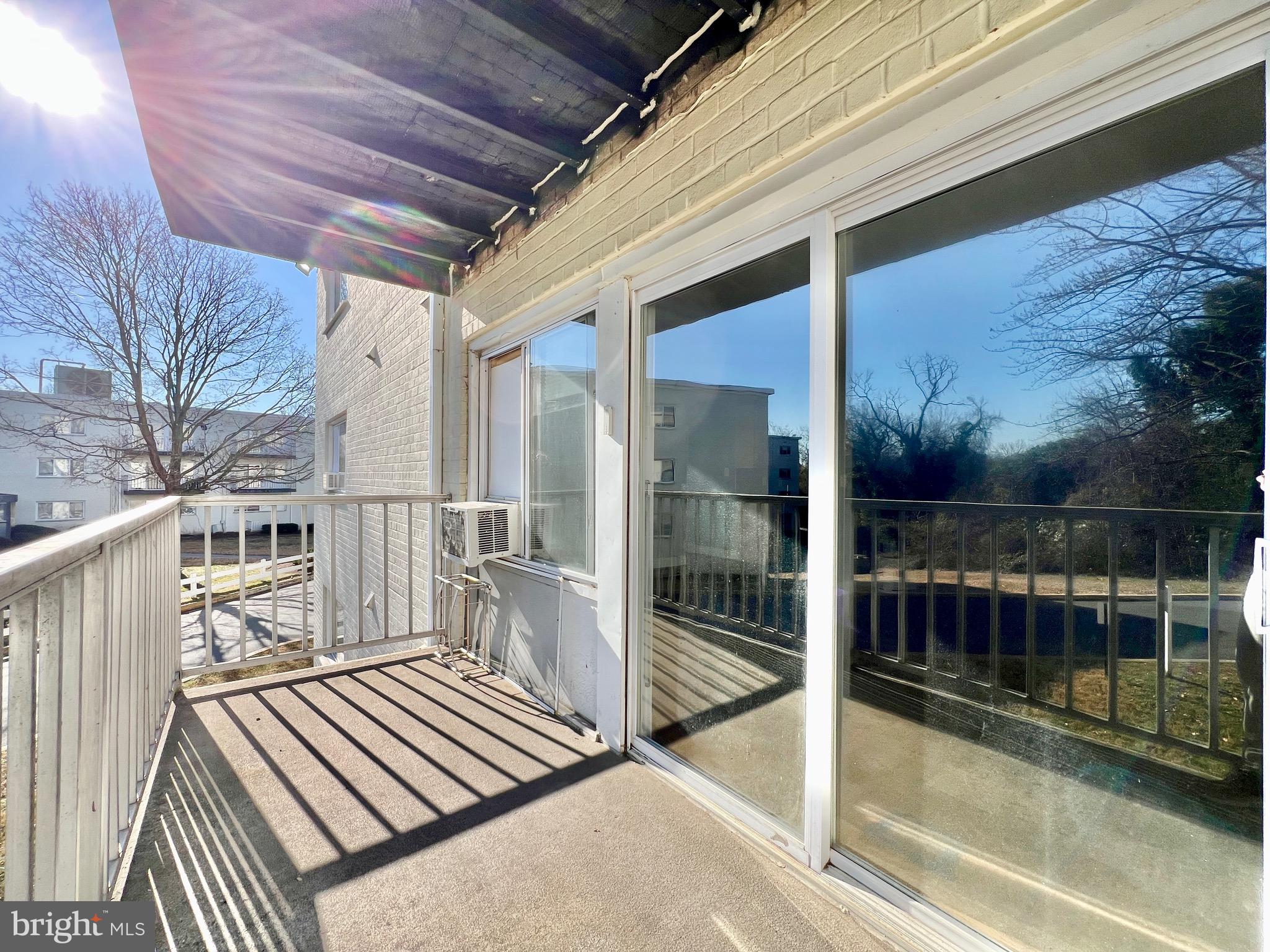 1009 Chillum Road, Unit 202 Hyattsville, MD 20782 - Photo 17 of 19 a view of a balcony with wooden floor