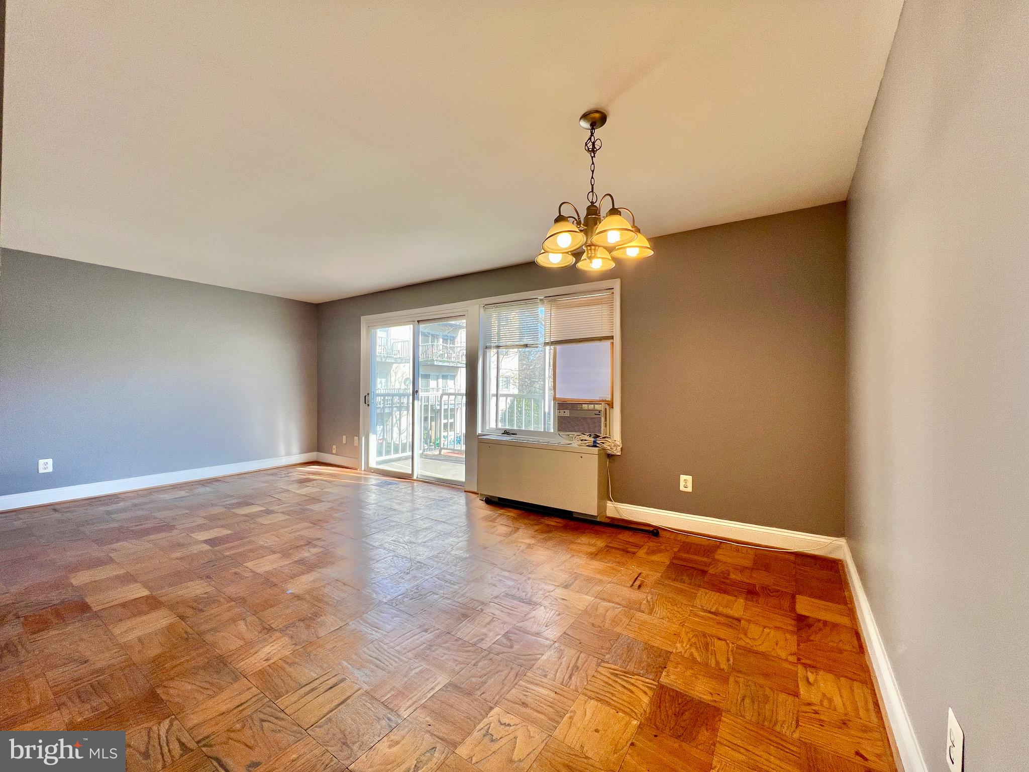 1009 Chillum Road, Unit 202 Hyattsville, MD 20782 - Photo 7 of 19 a view of an empty room with a window