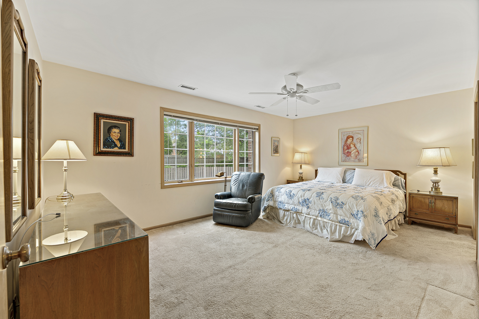 1000 Deerfield Road, Unit 101 Highland Park, IL 60035 - Photo 12 of 19 a spacious bedroom with a bed couch and a window