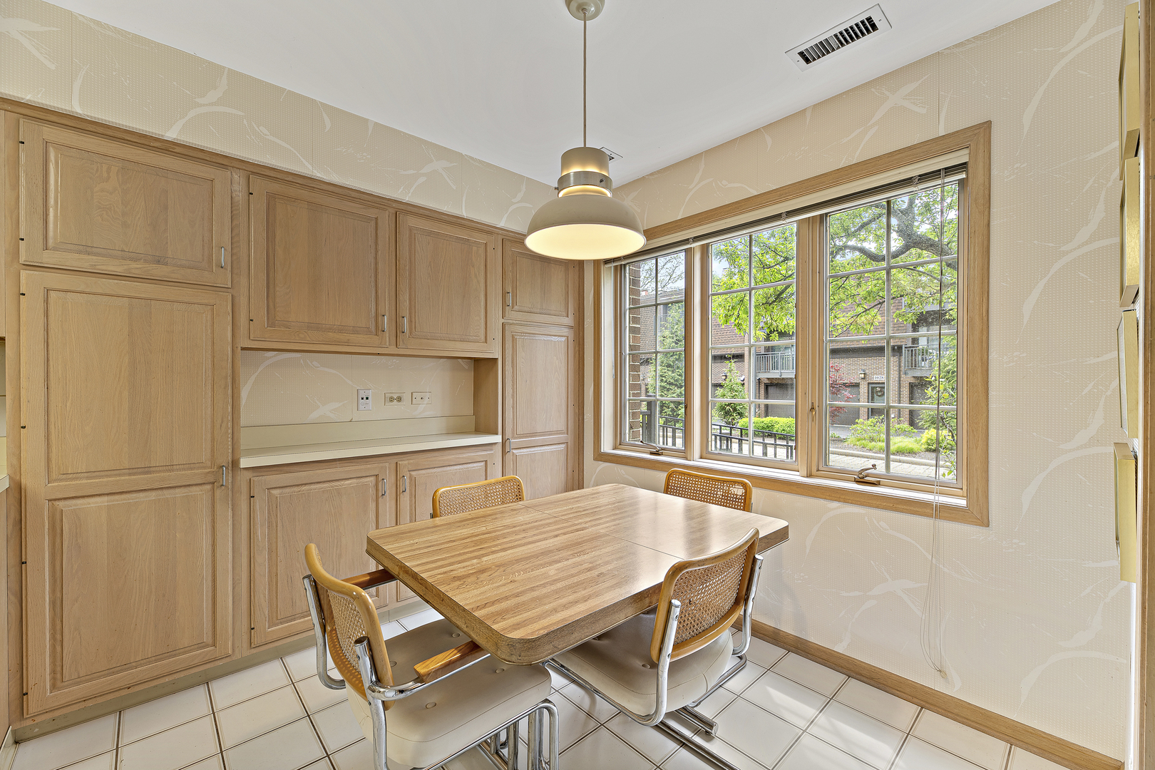 1000 Deerfield Road, Unit 101 Highland Park, IL 60035 - Photo 10 of 19 a dining room with stainless steel appliances granite countertop furniture and a window