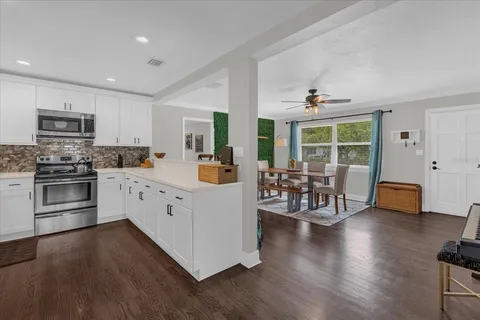 a kitchen with counter top space cabinets and stainless steel appliances