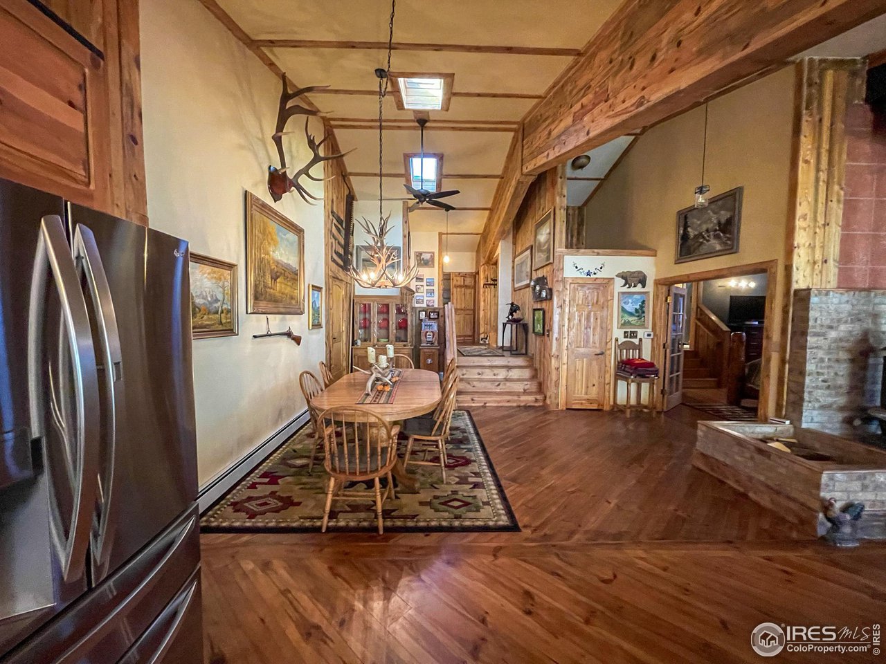 1448 Le Cook Road Allenspark, CO 80510 - Photo 14 of 39 a view of a living room with a rug