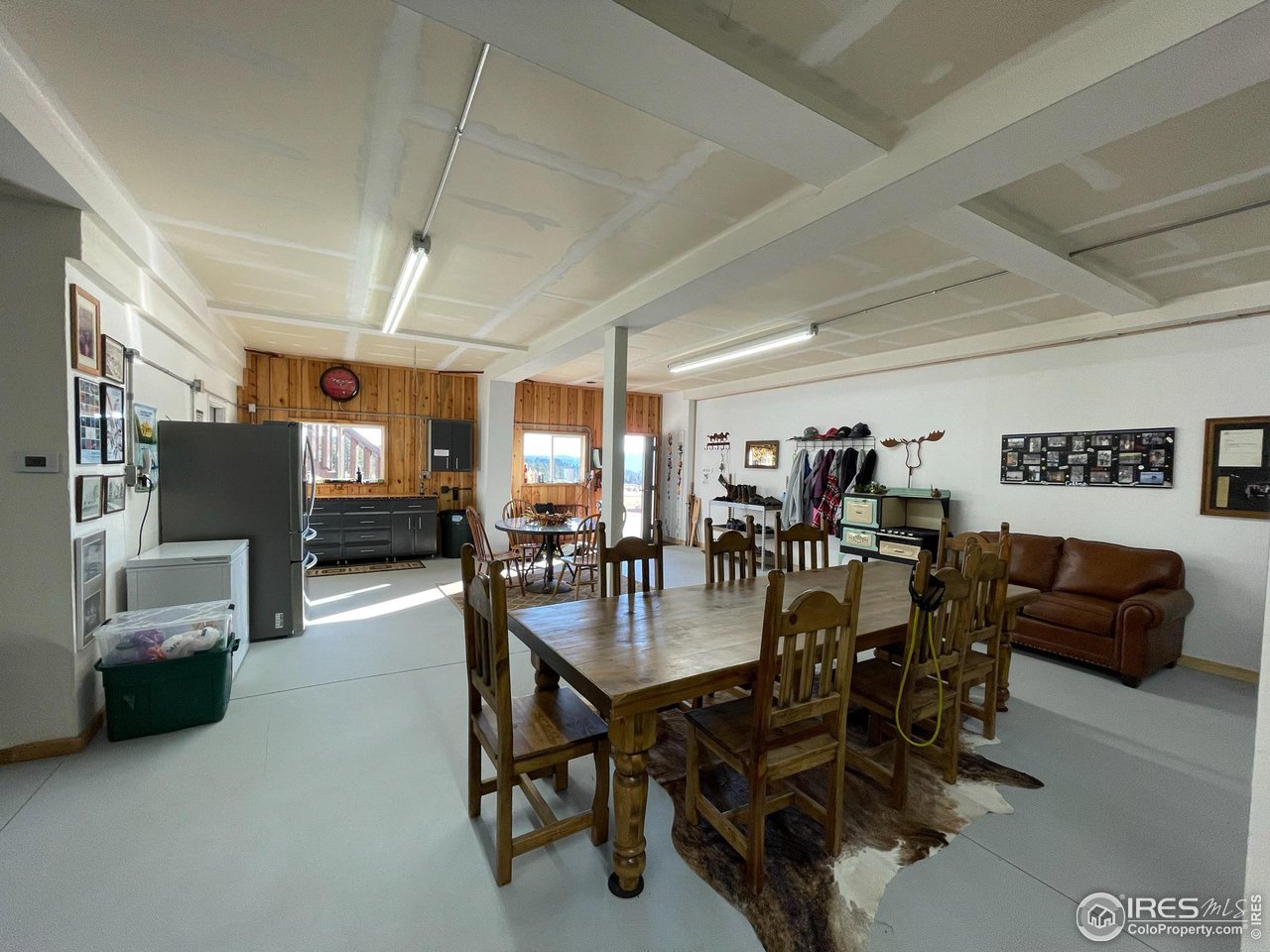 1448 Le Cook Road Allenspark, CO 80510 - Photo 19 of 39 a view of a dining room with furniture