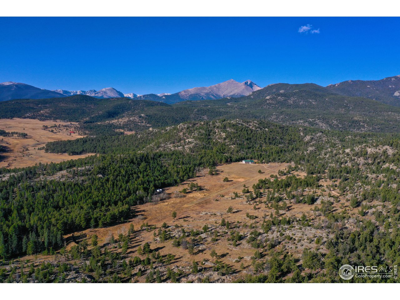 1448 Le Cook Road Allenspark, CO 80510 - Photo 2 of 39 a view of a mountain with a field