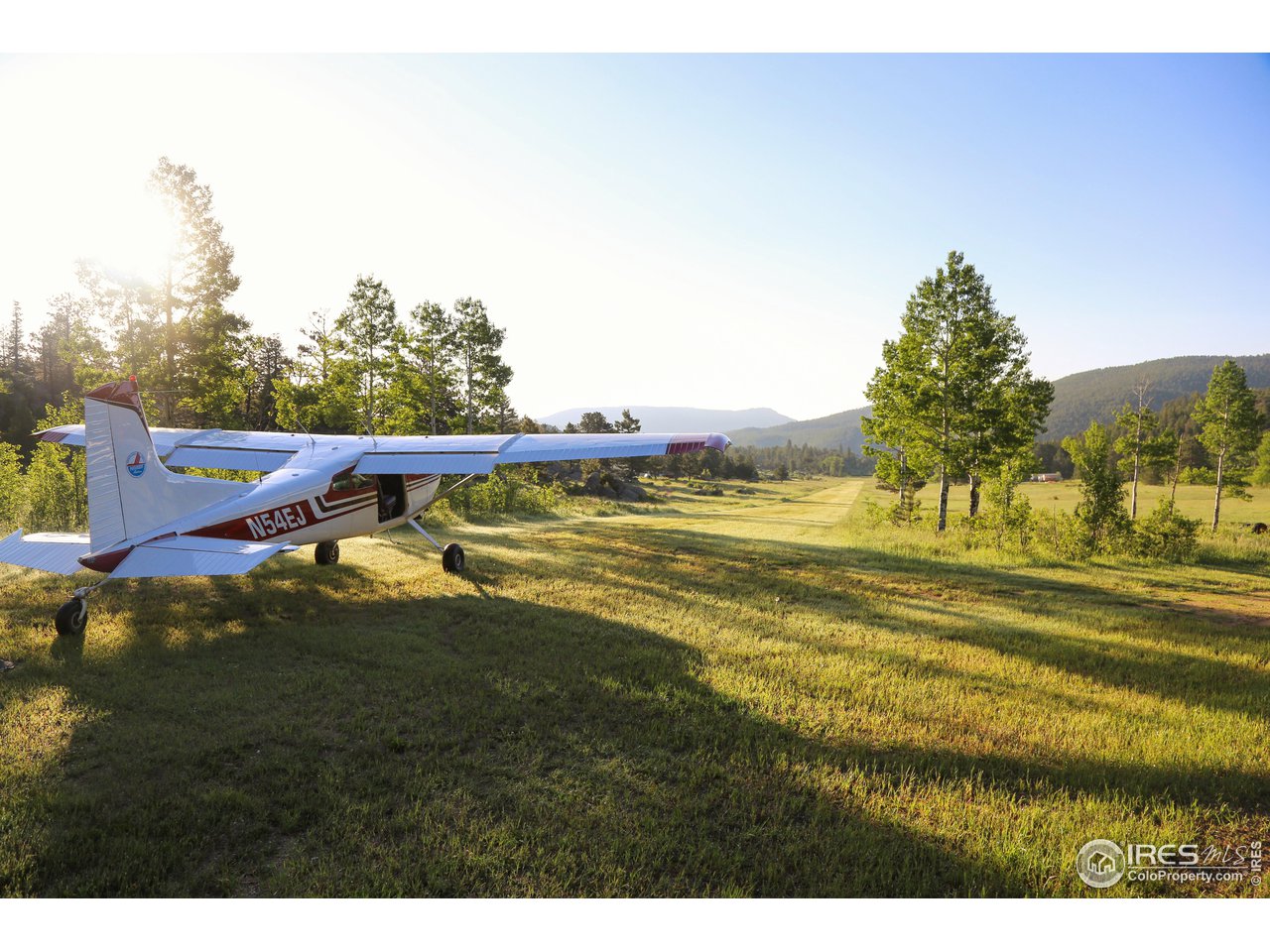 1448 Le Cook Road Allenspark, CO 80510 - Photo 23 of 39 a view of swimming pool with an outdoor space and seating area