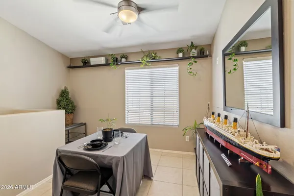 a bedroom with a bed and a table