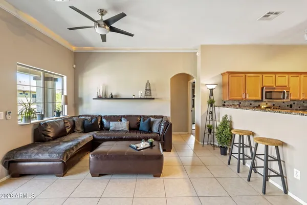 a living room with furniture and a large window