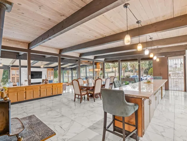 a kitchen with stainless steel appliances granite countertop a stove sink microwave and cabinets