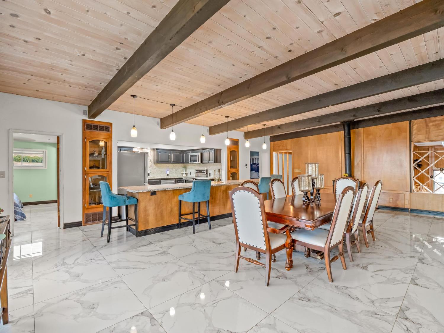 31204 Sierra Drive Exeter, CA 93221 - Photo 12 of 76 a dining room with furniture and a floor to ceiling window