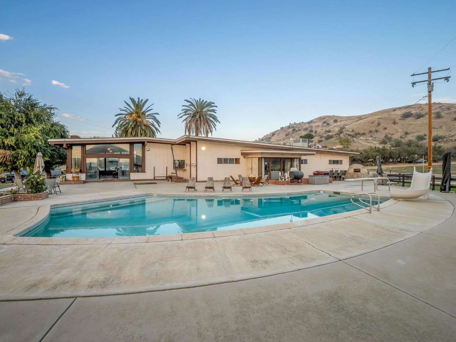 31204 Sierra Drive Exeter, CA 93221 - Photo 13 of 76 a view of house with outdoor space and tall windows