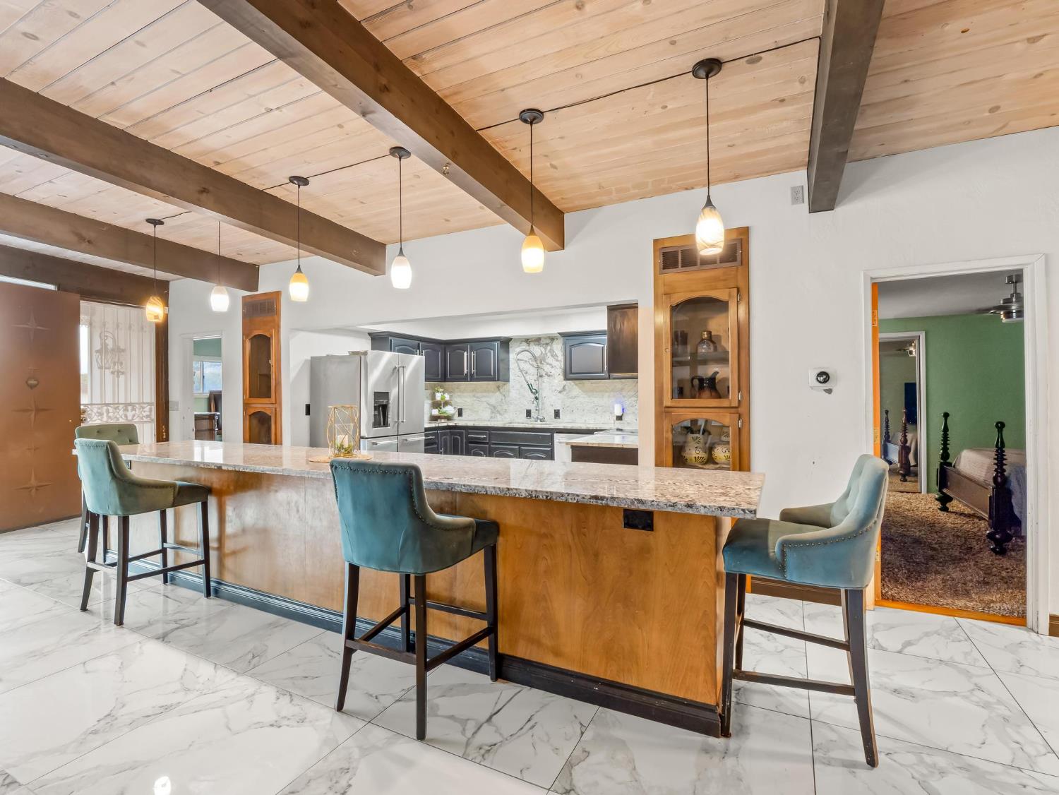 31204 Sierra Drive Exeter, CA 93221 - Photo 16 of 76 a dining hall with stainless steel appliances kitchen island granite countertop furniture and a kitchen view