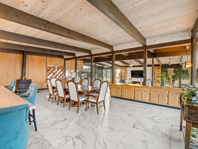 a kitchen with stainless steel appliances granite countertop a sink and a stove