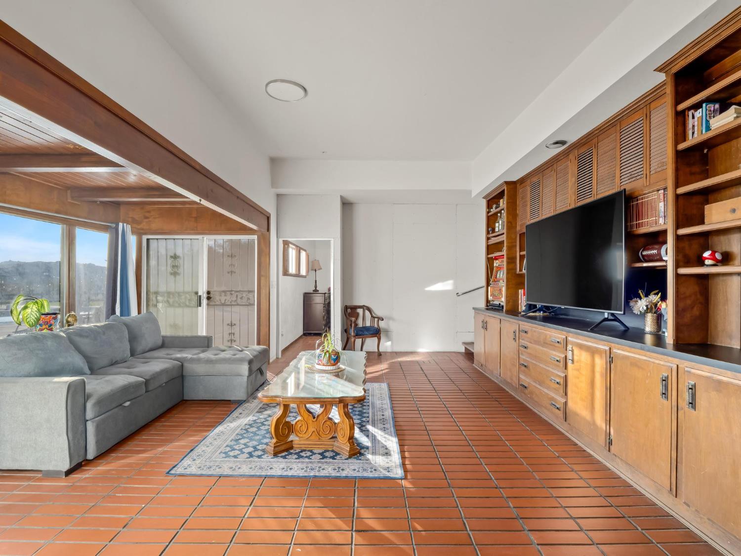 31204 Sierra Drive Exeter, CA 93221 - Photo 26 of 76 a living room with furniture and a flat screen tv