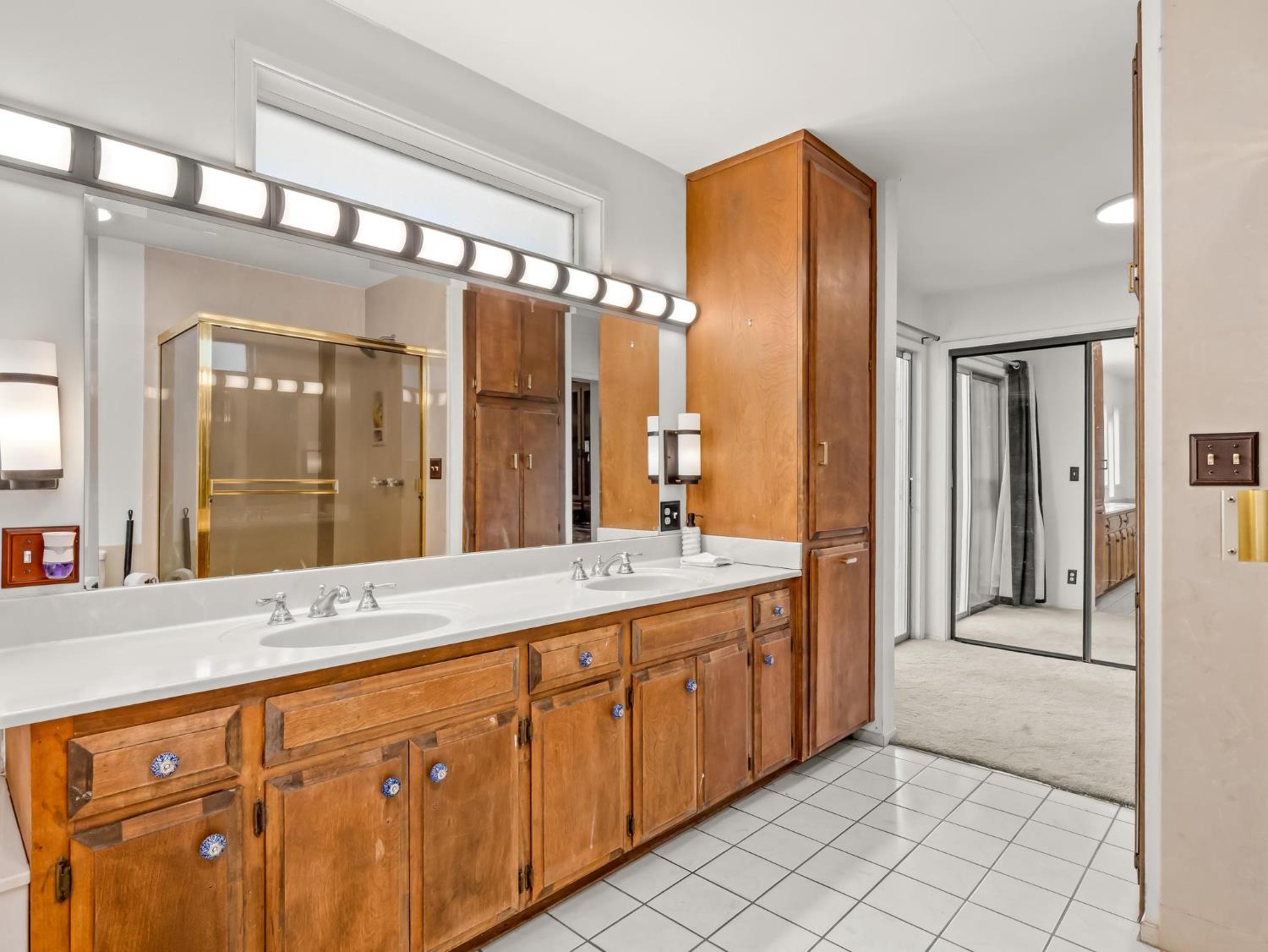 31204 Sierra Drive Exeter, CA 93221 - Photo 38 of 76 a spacious bathroom with a double vanity sink mirror and