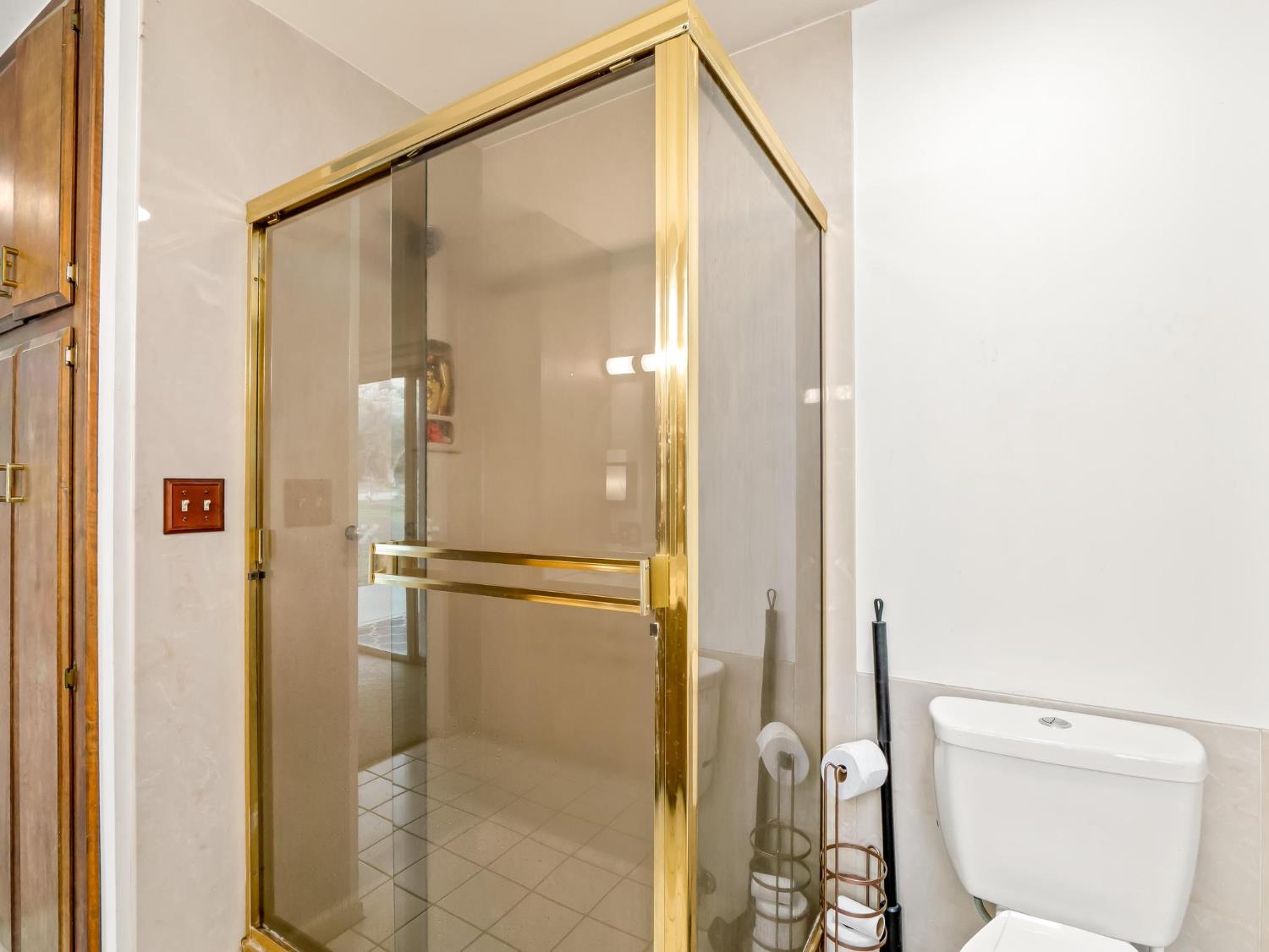 31204 Sierra Drive Exeter, CA 93221 - Photo 39 of 76 a bathroom with a shower and a toilet