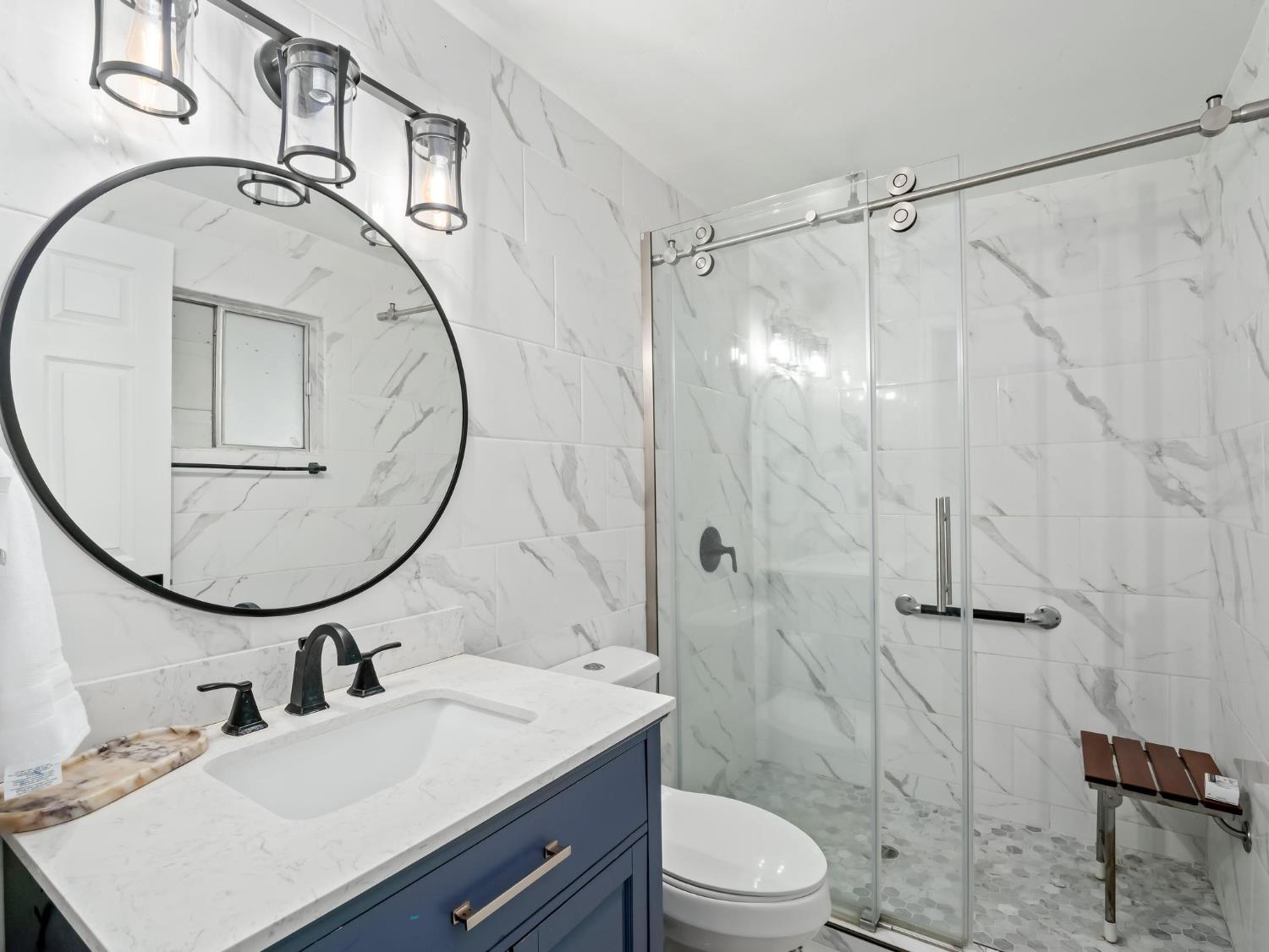 31204 Sierra Drive Exeter, CA 93221 - Photo 45 of 76 a bathroom with a sink toilet and a mirror