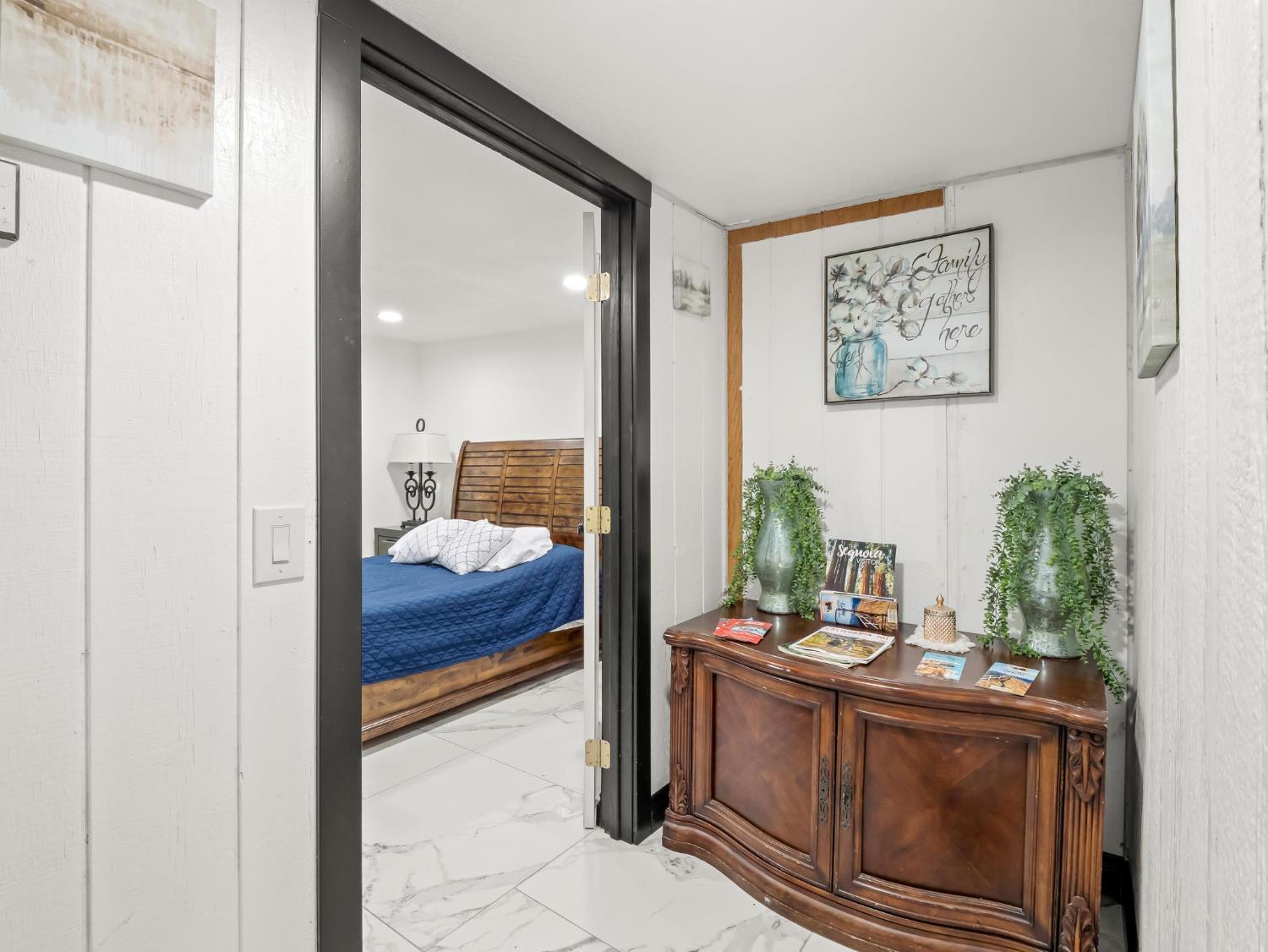 31204 Sierra Drive Exeter, CA 93221 - Photo 48 of 76 a living room with stainless steel appliances furniture and a potted plant