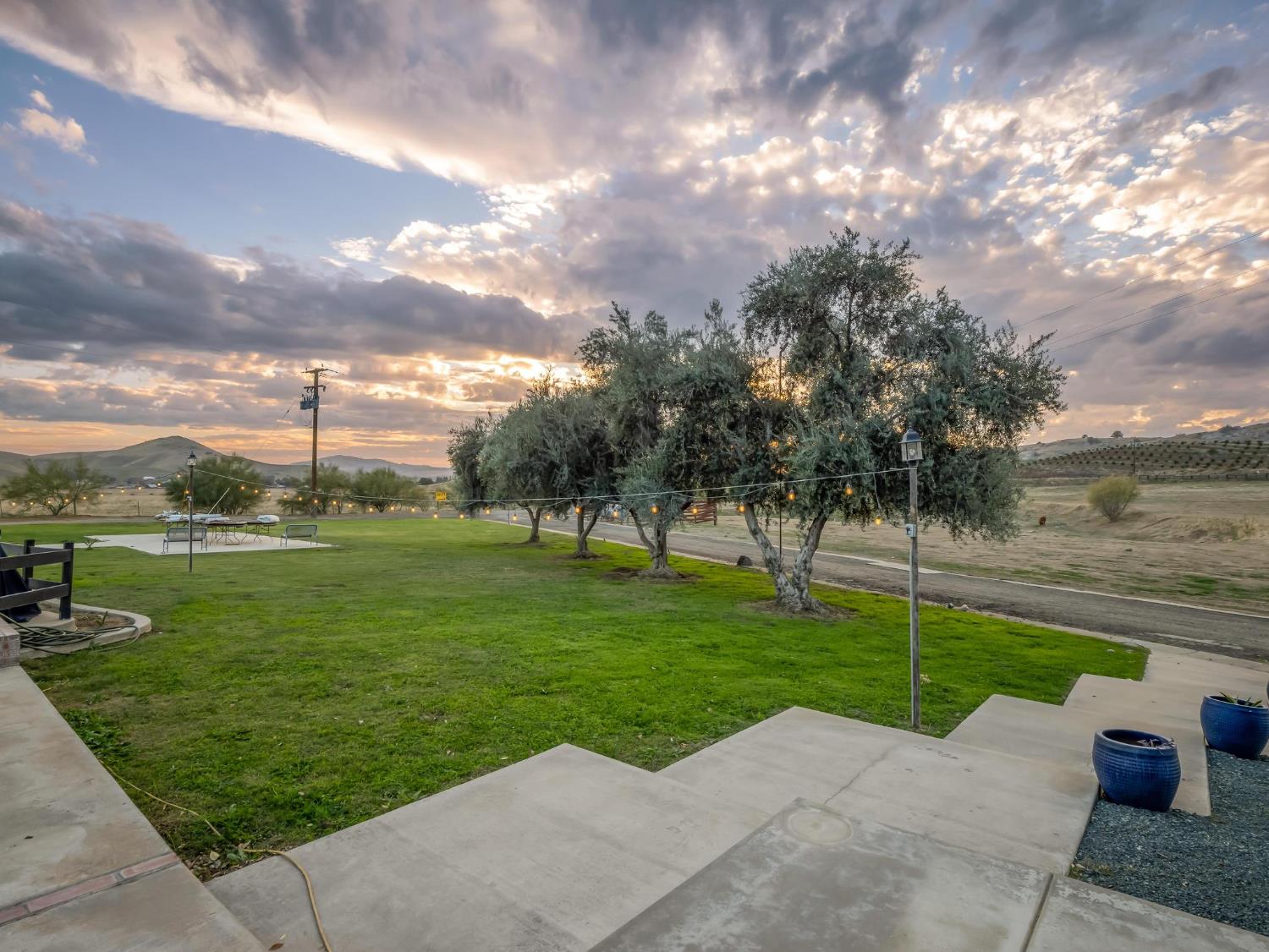 31204 Sierra Drive Exeter, CA 93221 - Photo 59 of 76 a view of a garden with a fountain