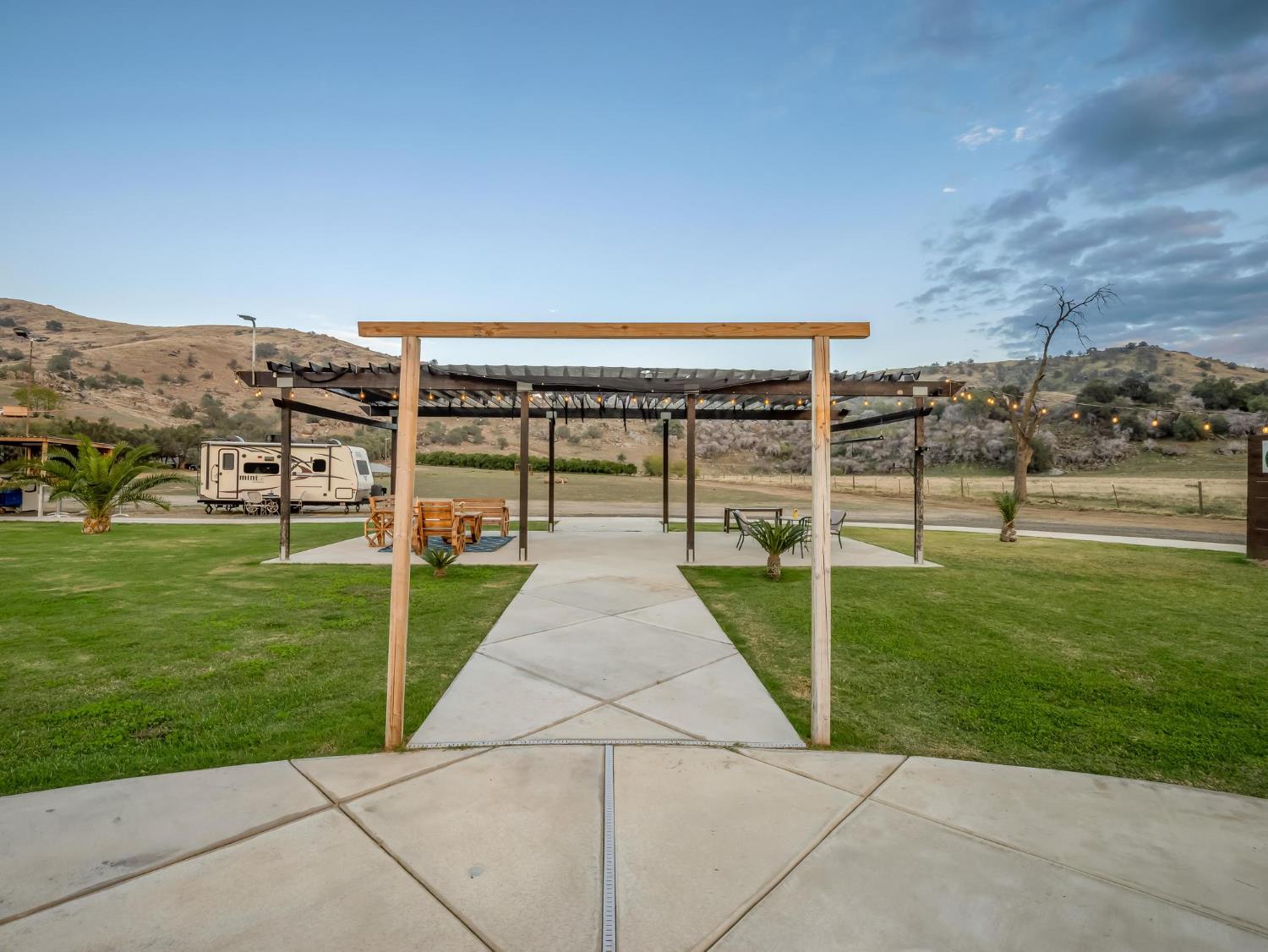 31204 Sierra Drive Exeter, CA 93221 - Photo 62 of 76 a view of a garden with a building in the background