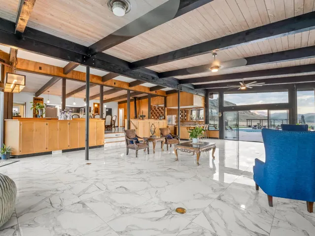 a view of house with outdoor space and tall windows