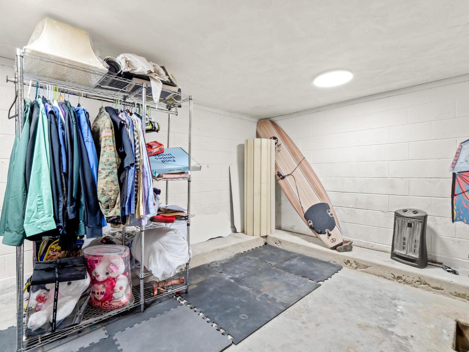31204 Sierra Drive Exeter, CA 93221 - Photo 74 of 76 a view of walk in closet with clothes and shoes