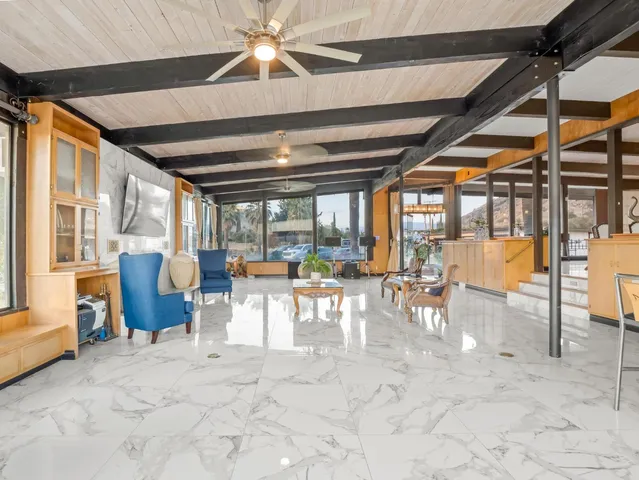 a view of a dining area with furniture and a window
