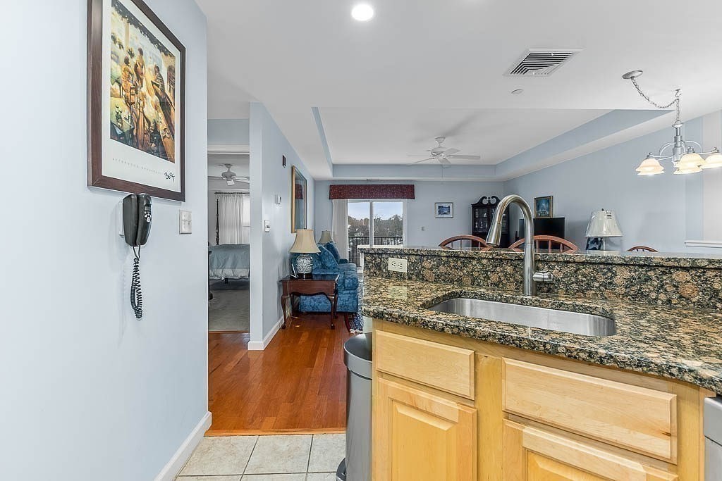 989 East Street, Unit 402 Dedham, MA 02026 - Photo 12 of 28 a kitchen with sink and refrigerator