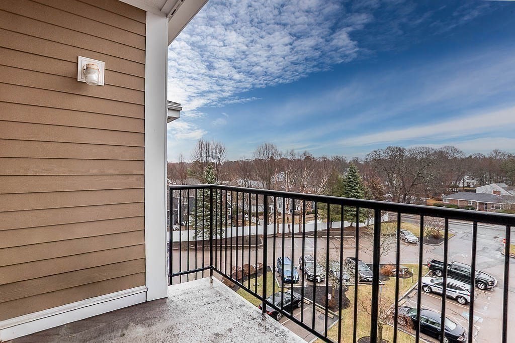 989 East Street, Unit 402 Dedham, MA 02026 - Photo 19 of 28 a view of a balcony with outside space