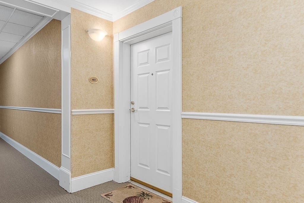 989 East Street, Unit 402 Dedham, MA 02026 - Photo 20 of 28 a bathroom with a shower