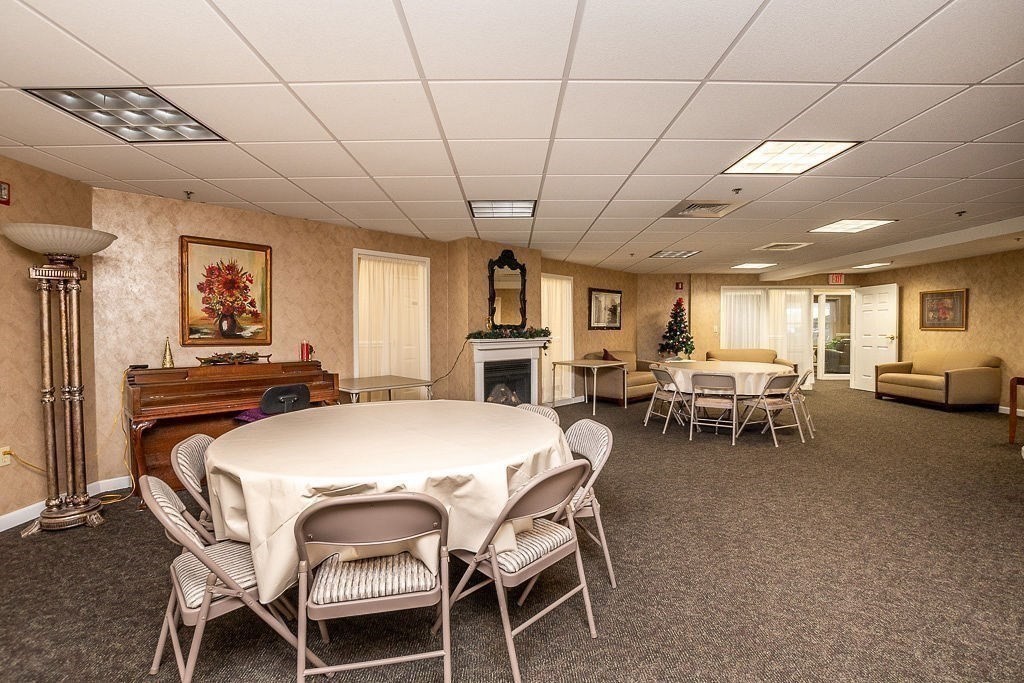 989 East Street, Unit 402 Dedham, MA 02026 - Photo 28 of 28 a dining room with furniture and window