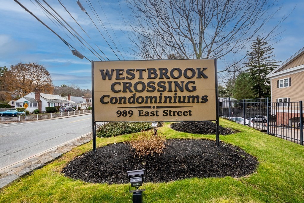 989 East Street, Unit 402 Dedham, MA 02026 - Photo 4 of 28 a view of a sign board