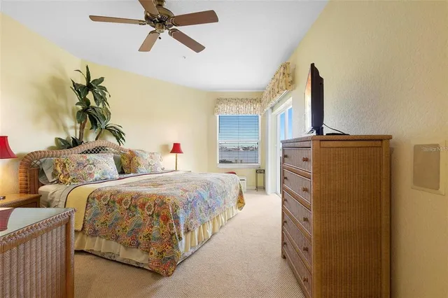 a bedroom with two beds and a chandelier