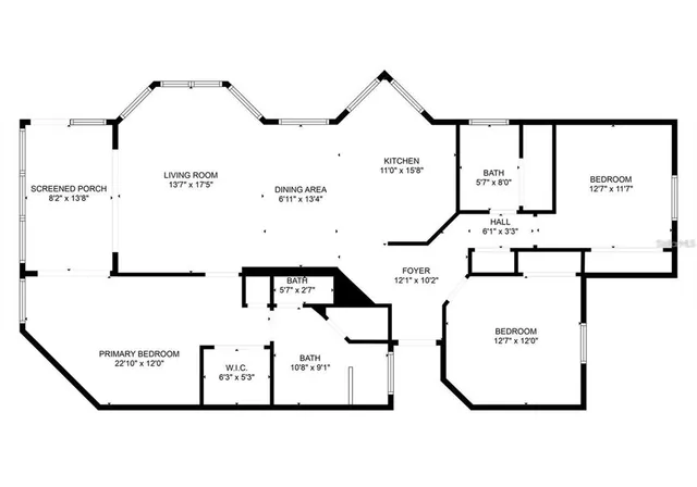 a view of an outdoor dining space with a table and chairs