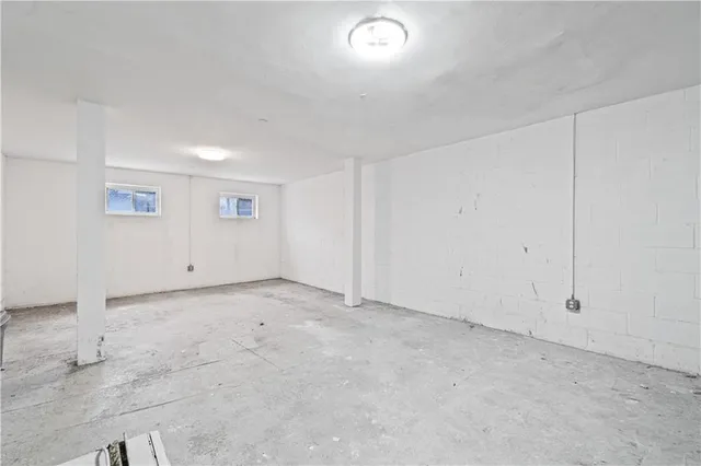 an empty room with white walls