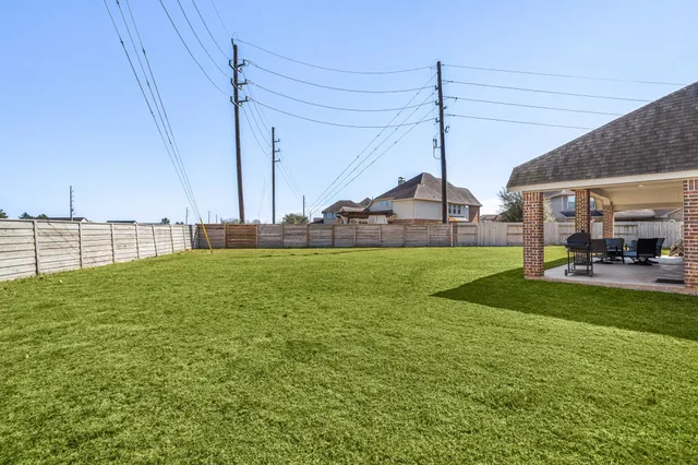 a front view of house with yard and garage