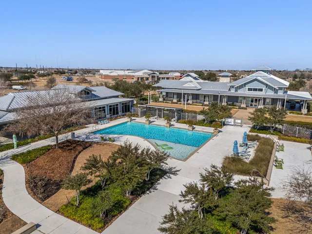 an aerial view of a house with outdoor space