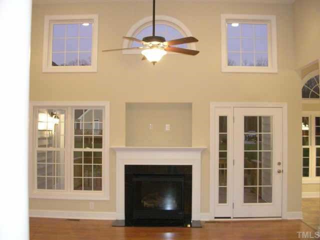75 Grey Fox Run Road Timberlake, NC 27583 - Photo 4 of 10 Greatroom with 14' ceiling, lots of palladian windows,gas log fireplace & TV nook