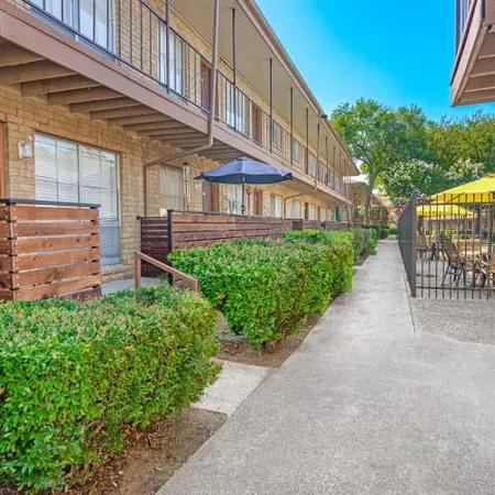 a view of a building with a yard