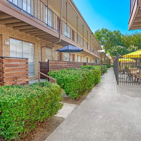 a view of a building with a yard