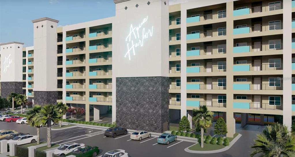 5015 Highway 19, Unit 201 New Port Richey, FL 34652 - Photo 1 of 24 a front view of a building with a garden