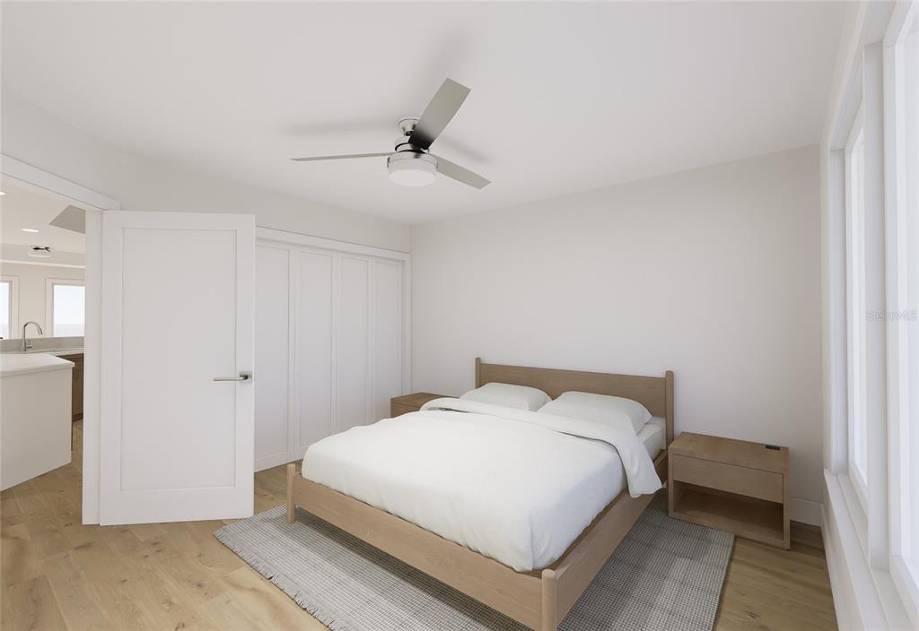 5015 Highway 19, Unit 201 New Port Richey, FL 34652 - Photo 22 of 24 a bedroom with a bed and a table