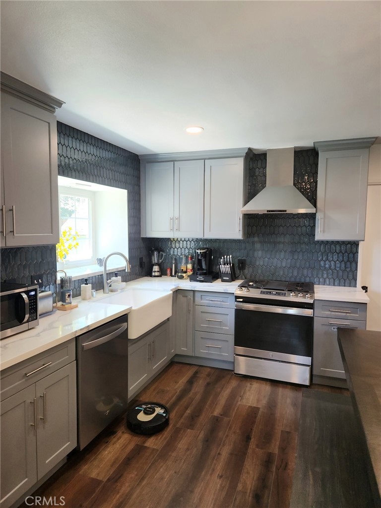 25935 Ranger Drive Twin Peaks, CA 92391 - Photo 13 of 30 a kitchen with a sink stove and cabinets