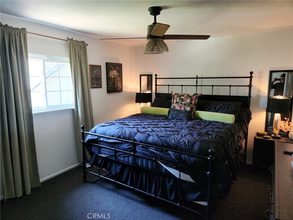 25935 Ranger Drive Twin Peaks, CA 92391 - Photo 14 of 30 a bedroom with a bed and large windows