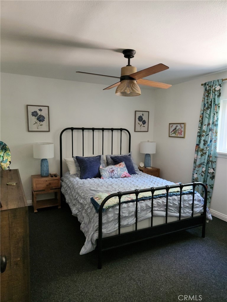 25935 Ranger Drive Twin Peaks, CA 92391 - Photo 15 of 30 a bed sitting in a bedroom next to a window