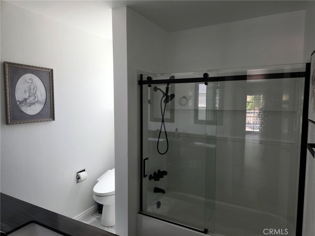 25935 Ranger Drive Twin Peaks, CA 92391 - Photo 18 of 30 a bathroom with a shower a toilet and a sink