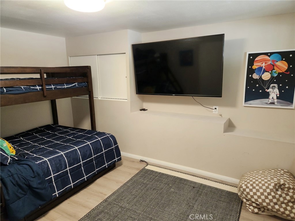 25935 Ranger Drive Twin Peaks, CA 92391 - Photo 20 of 30 a bedroom with a bed and flat screen tv