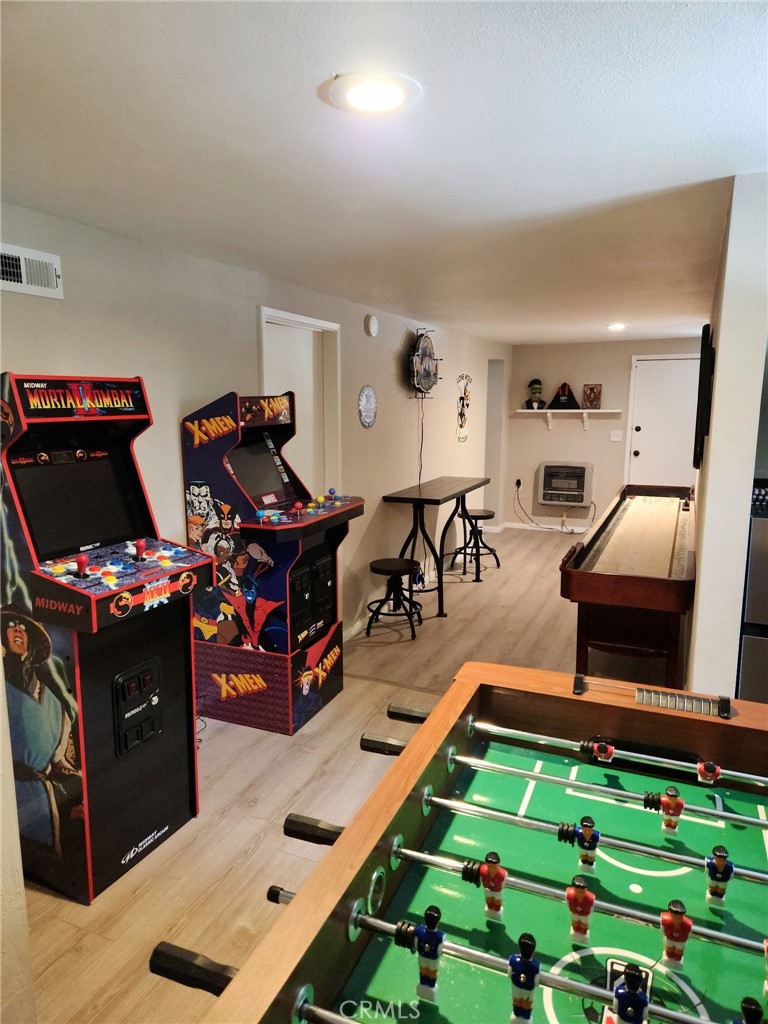 25935 Ranger Drive Twin Peaks, CA 92391 - Photo 21 of 30 a room with musical instruments on wooden floor