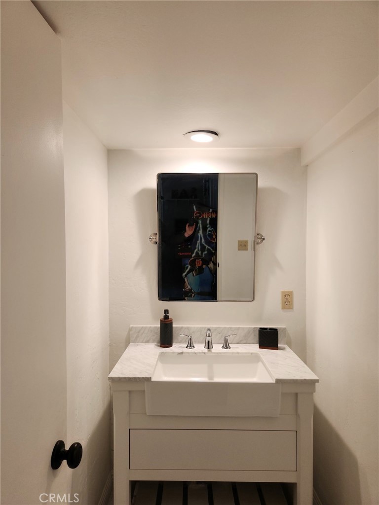 25935 Ranger Drive Twin Peaks, CA 92391 - Photo 24 of 30 a bathroom with a sink and a mirror