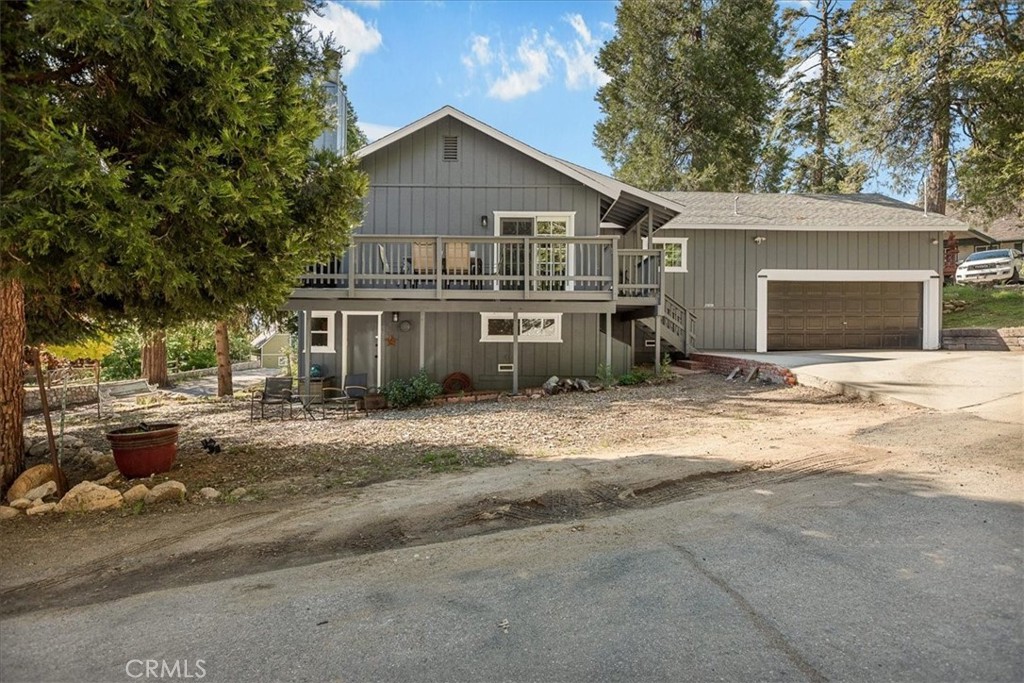 25935 Ranger Drive Twin Peaks, CA 92391 - Photo 26 of 30 a view of a house with a yard